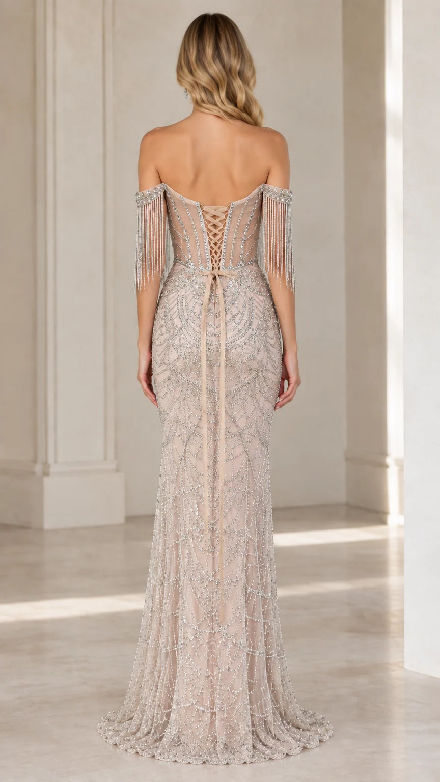 Back view of champagne formal gown showcasing lace-up corset closure