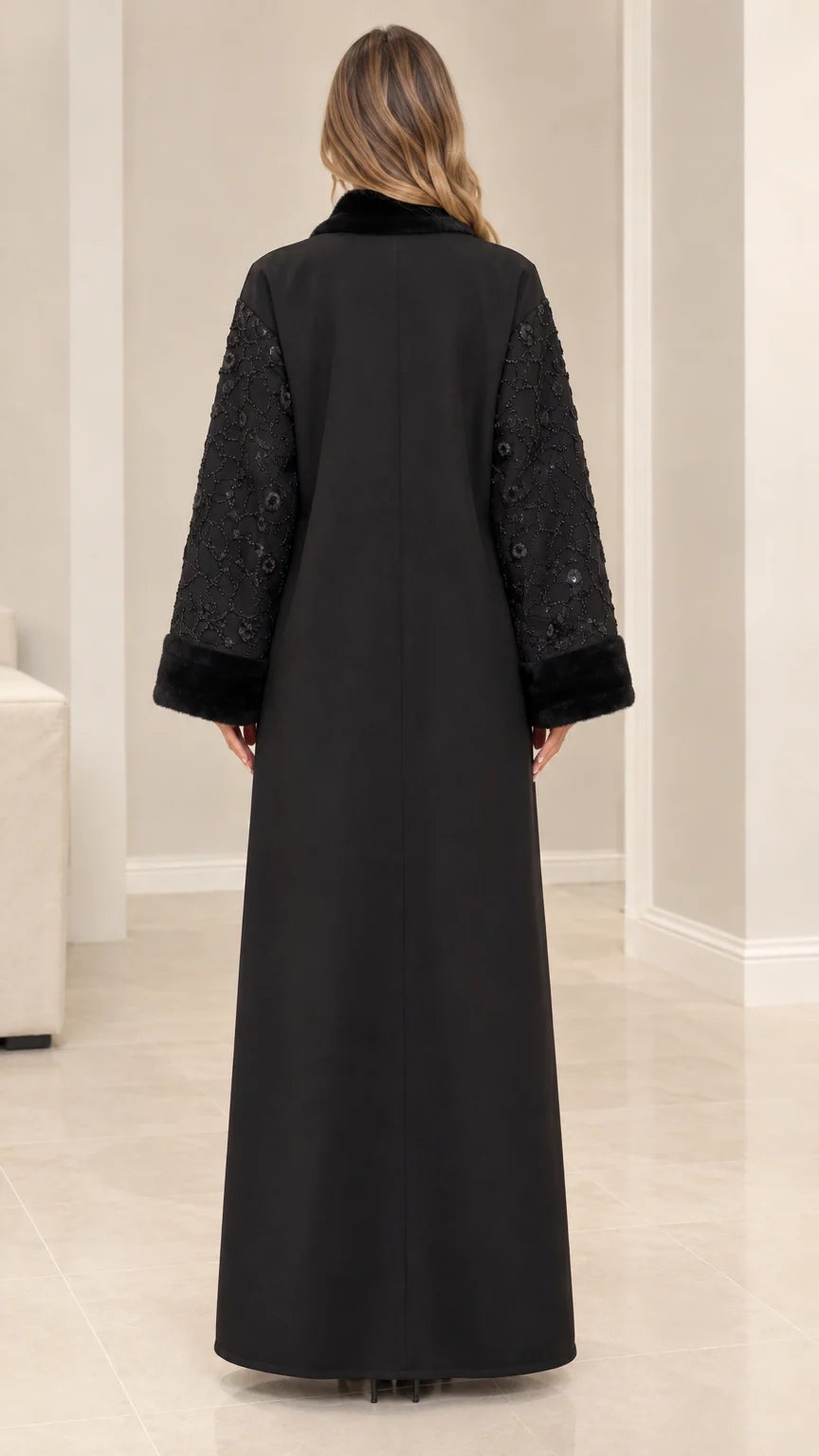 Back full-length view of black maxi evening coat showing tailored silhouette