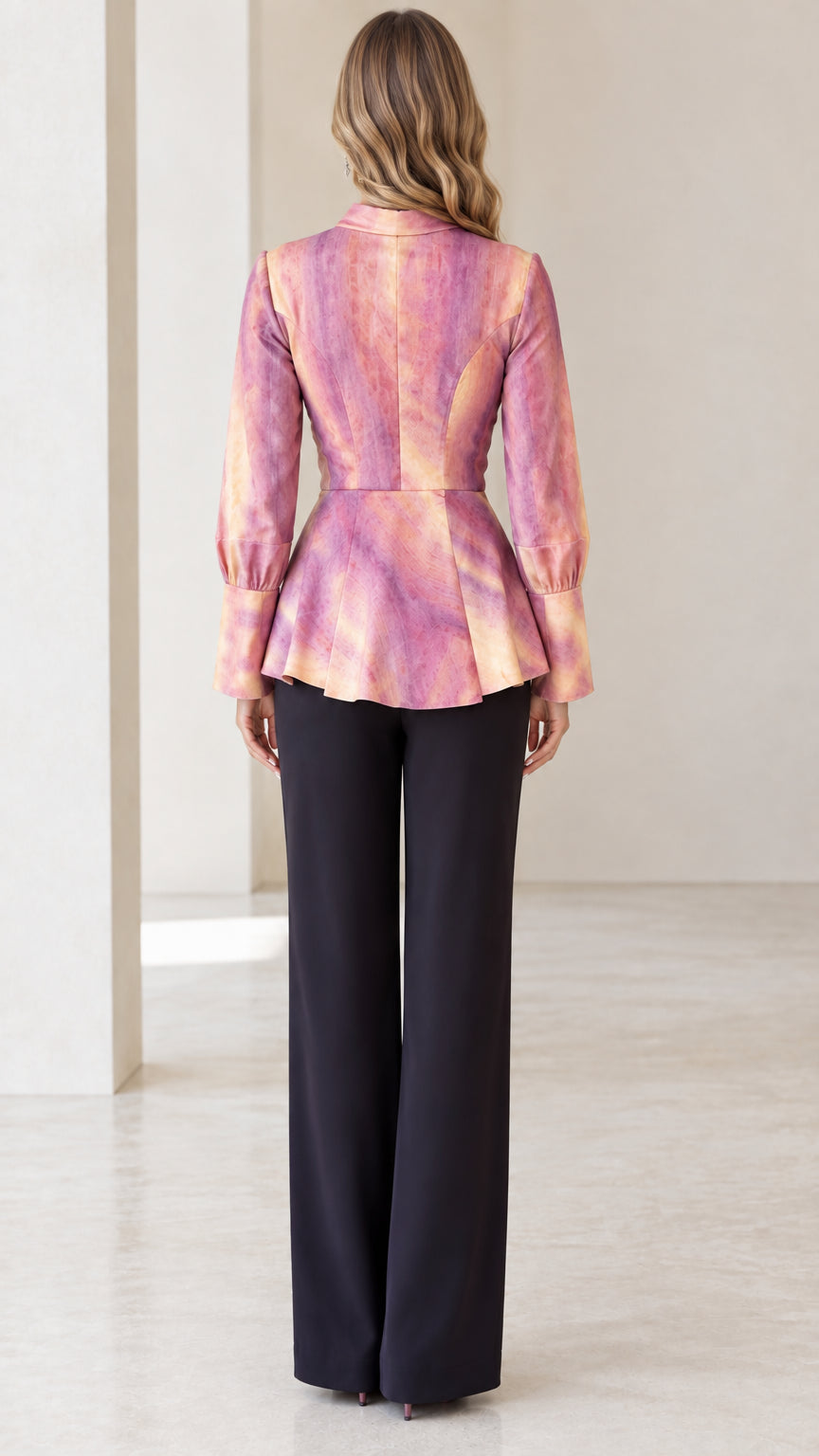 Back view of model in Blush Pink tailored peplum blouse with contoured seams