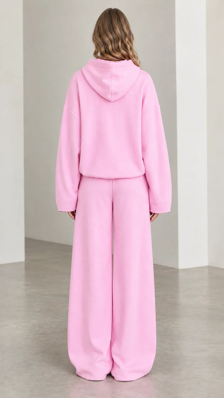 Back full-length view of woman in Light Pink two-piece hooded loungewear set