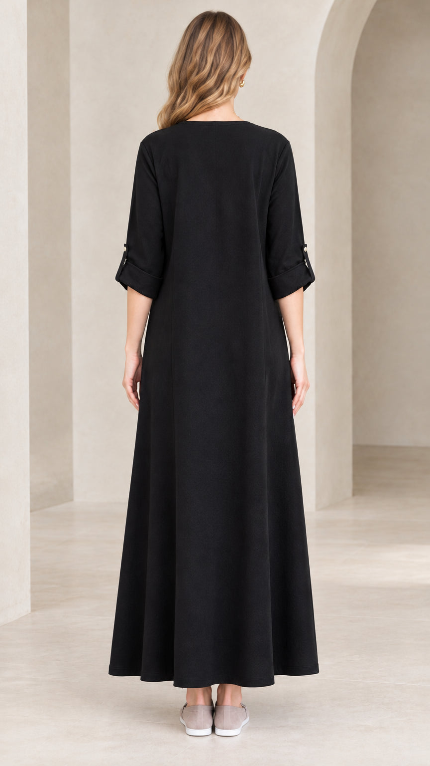 Back view of model wearing relaxed black maxi dress