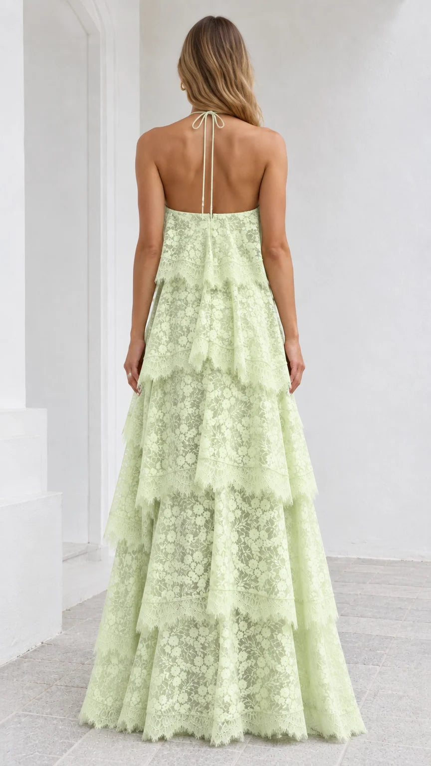 Back view of Mint Green lace halter maxi dress with tie straps and open back
