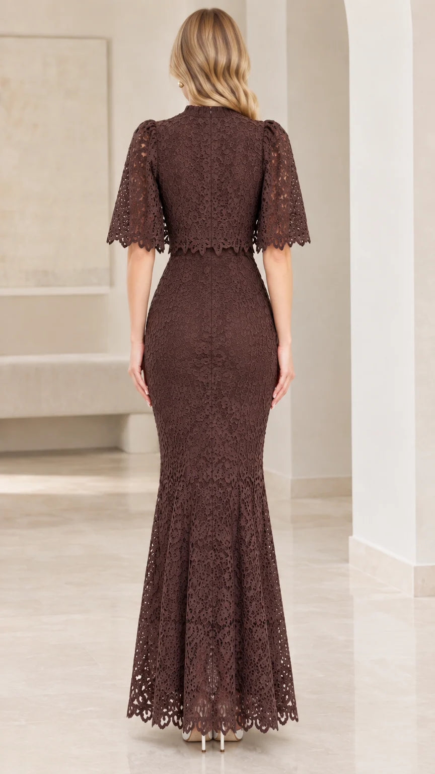 Back view of chocolate brown lace evening dress showing capelet and zipper closure