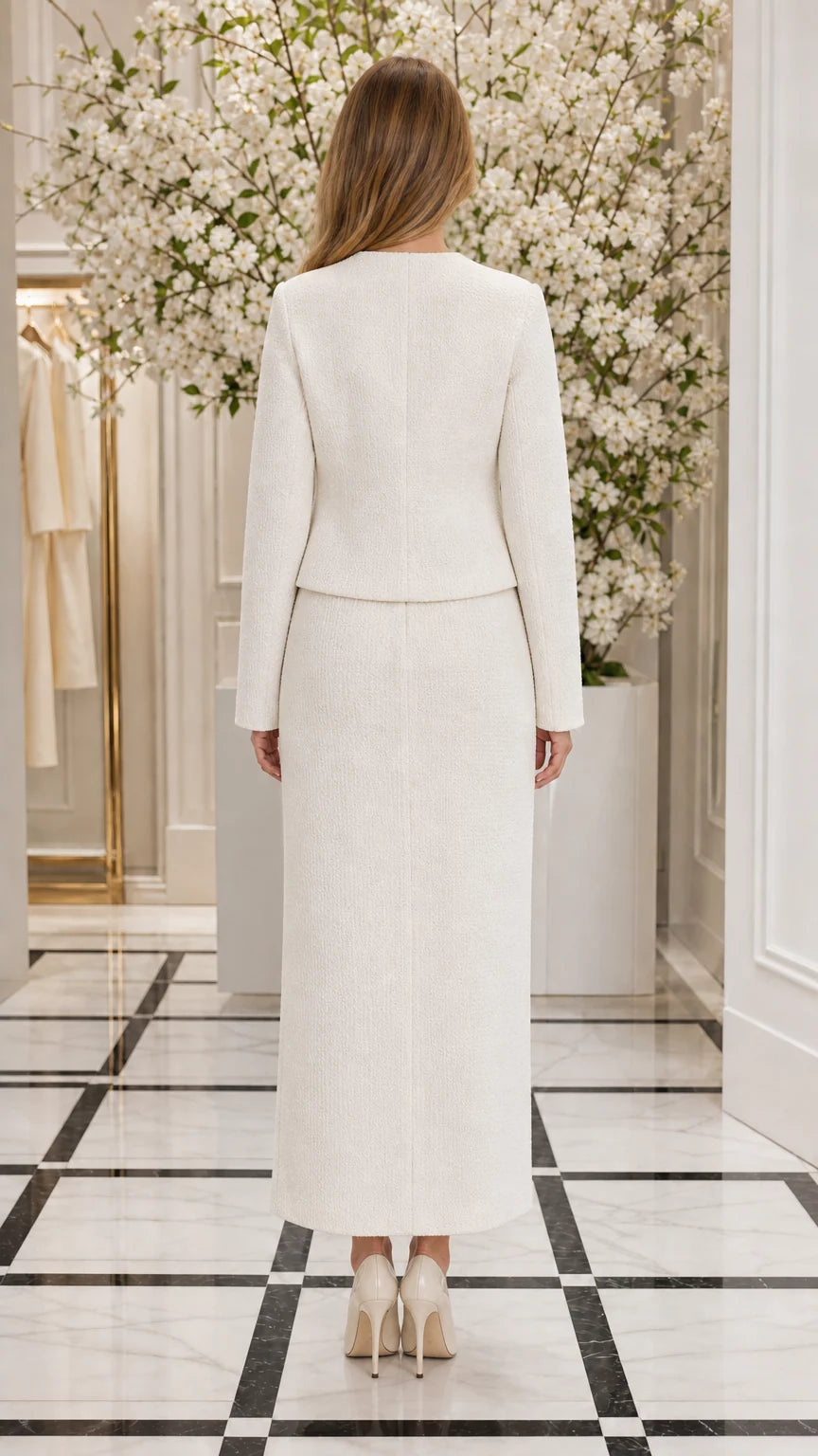 Back view of woman wearing Ivory White tailored jacket and maxi skirt