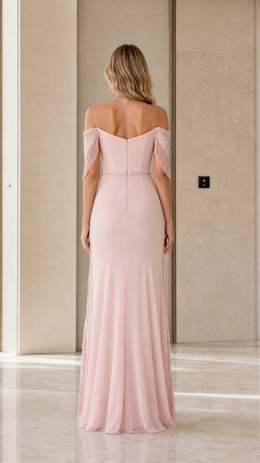 Back view of dusty rose maxi gown showing fitted bodice and flowing hemline