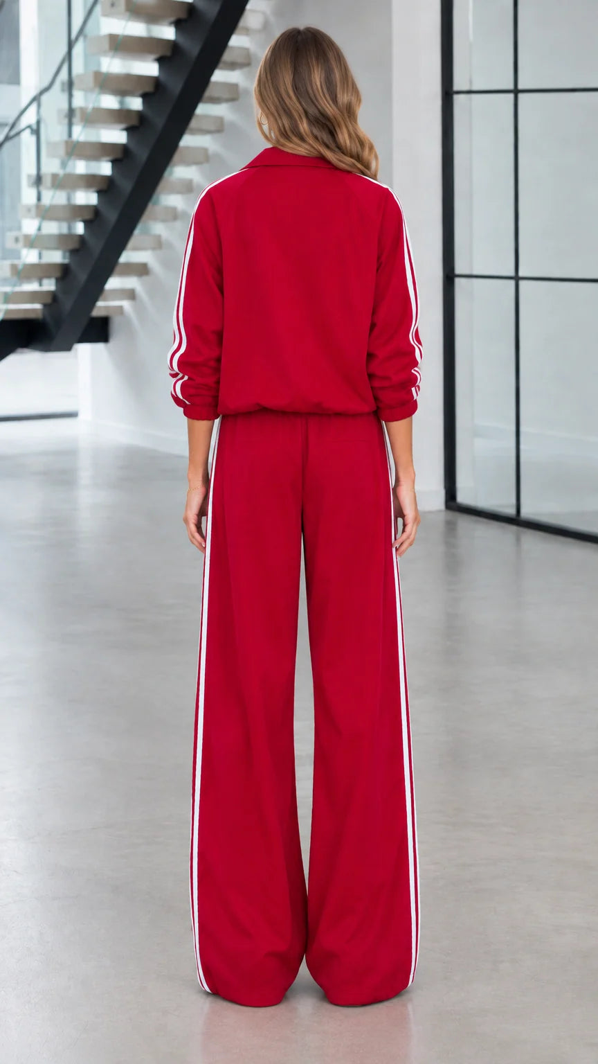 Back view of woman wearing red casual athletic two-piece tracksuit set