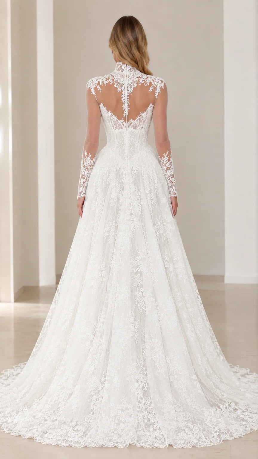 Back view of model showcasing the sheer illusion lace back and train of the White gown