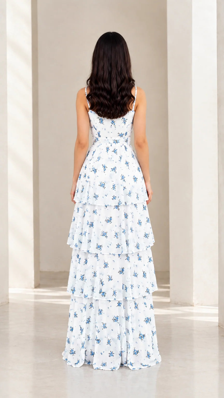 Back view of model in white floral tiered maxi dress showing strap and back detail