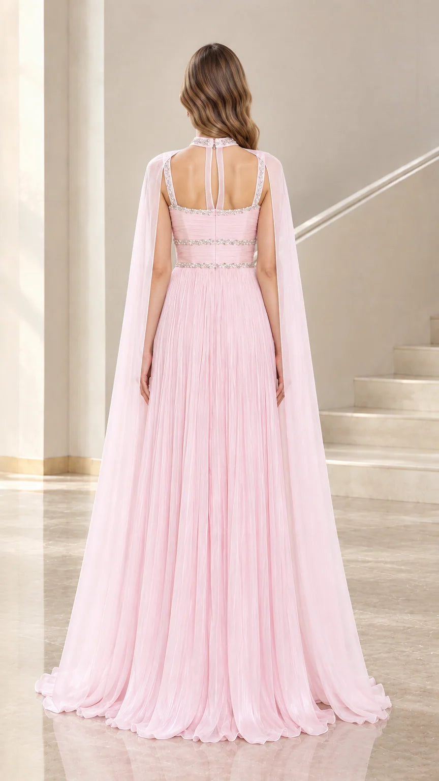 Back view of Light Pink evening gown showcasing cut-out straps and sweeping cape