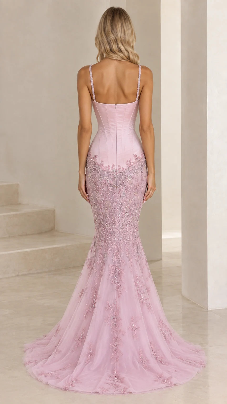 Blush pink embellished mermaid gown back view with flared train