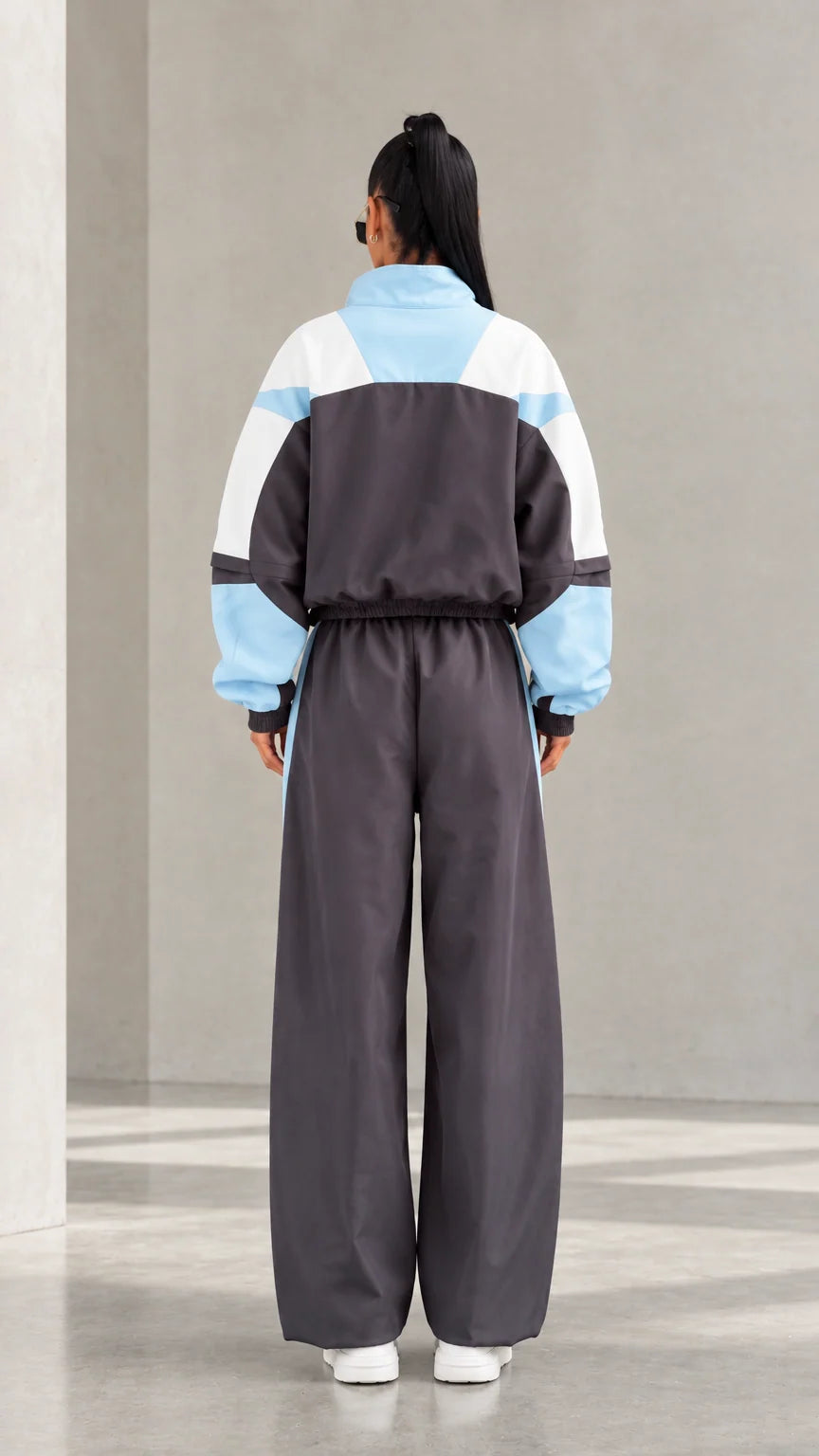 Model wearing Charcoal Grey colorblock tracksuit set back view