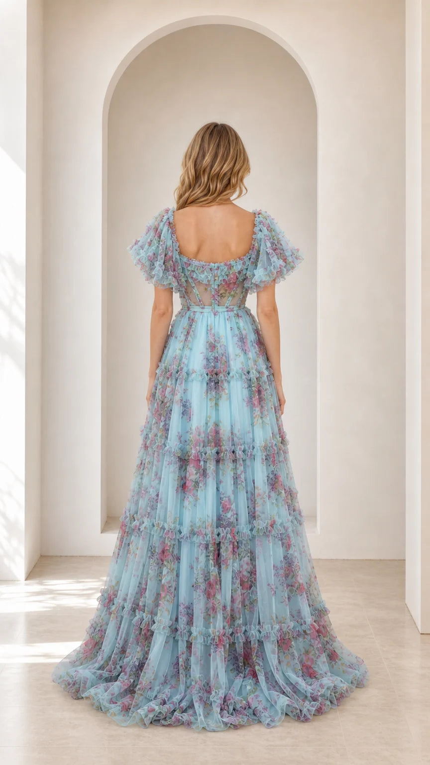 Back view of model wearing light blue floral tulle gown with square back