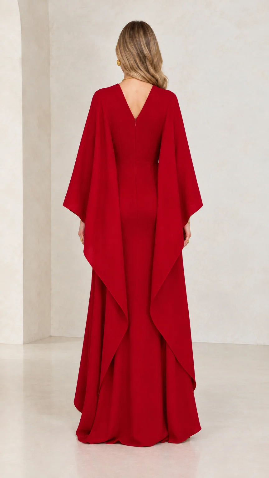 Back view of red V-back cape sleeve mermaid maxi gown