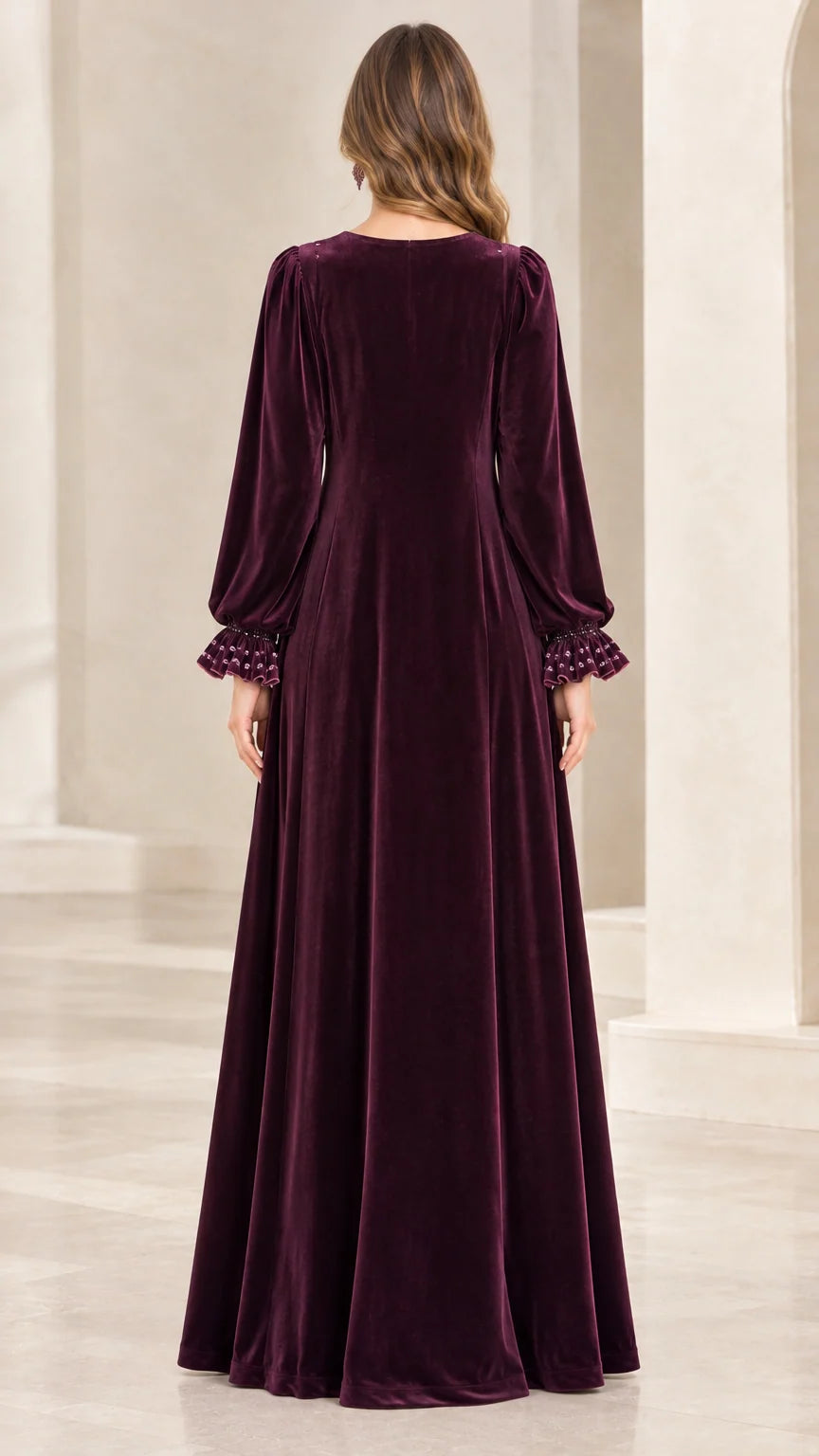 Back full-length view of woman in Plum velvet formal maxi dress