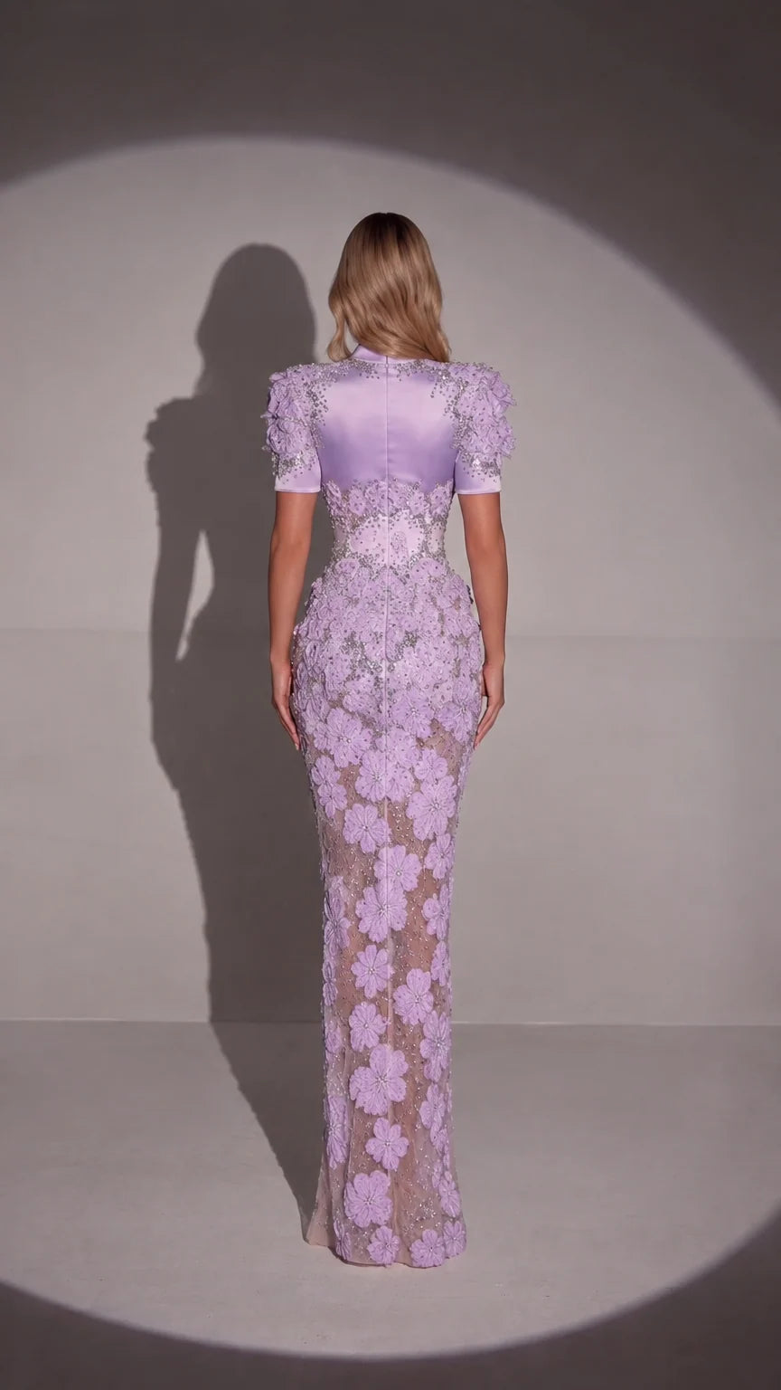 Back full-length view of lavender embellished formal evening gown