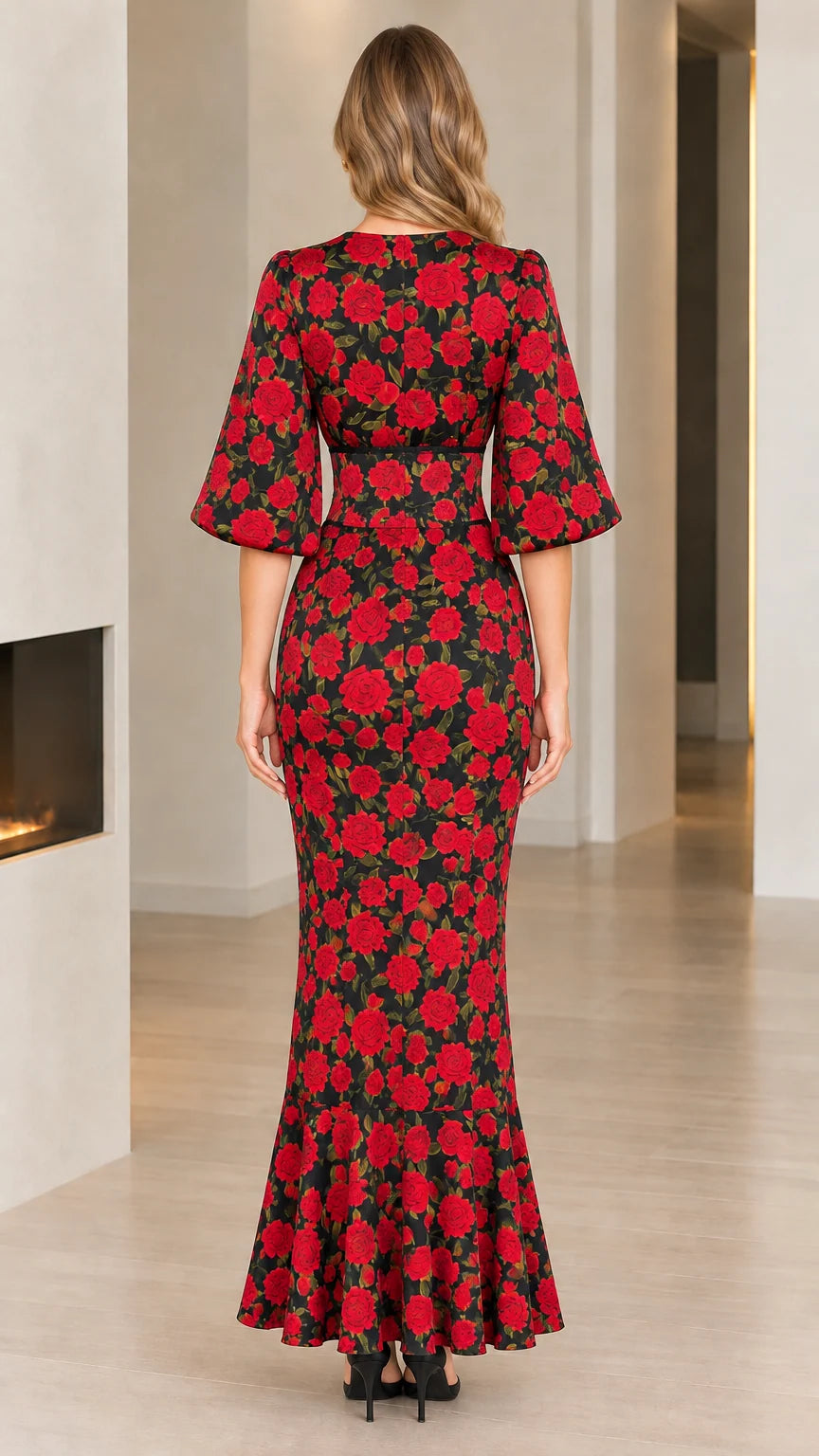 Back view of model wearing full-length black floral rose print dress