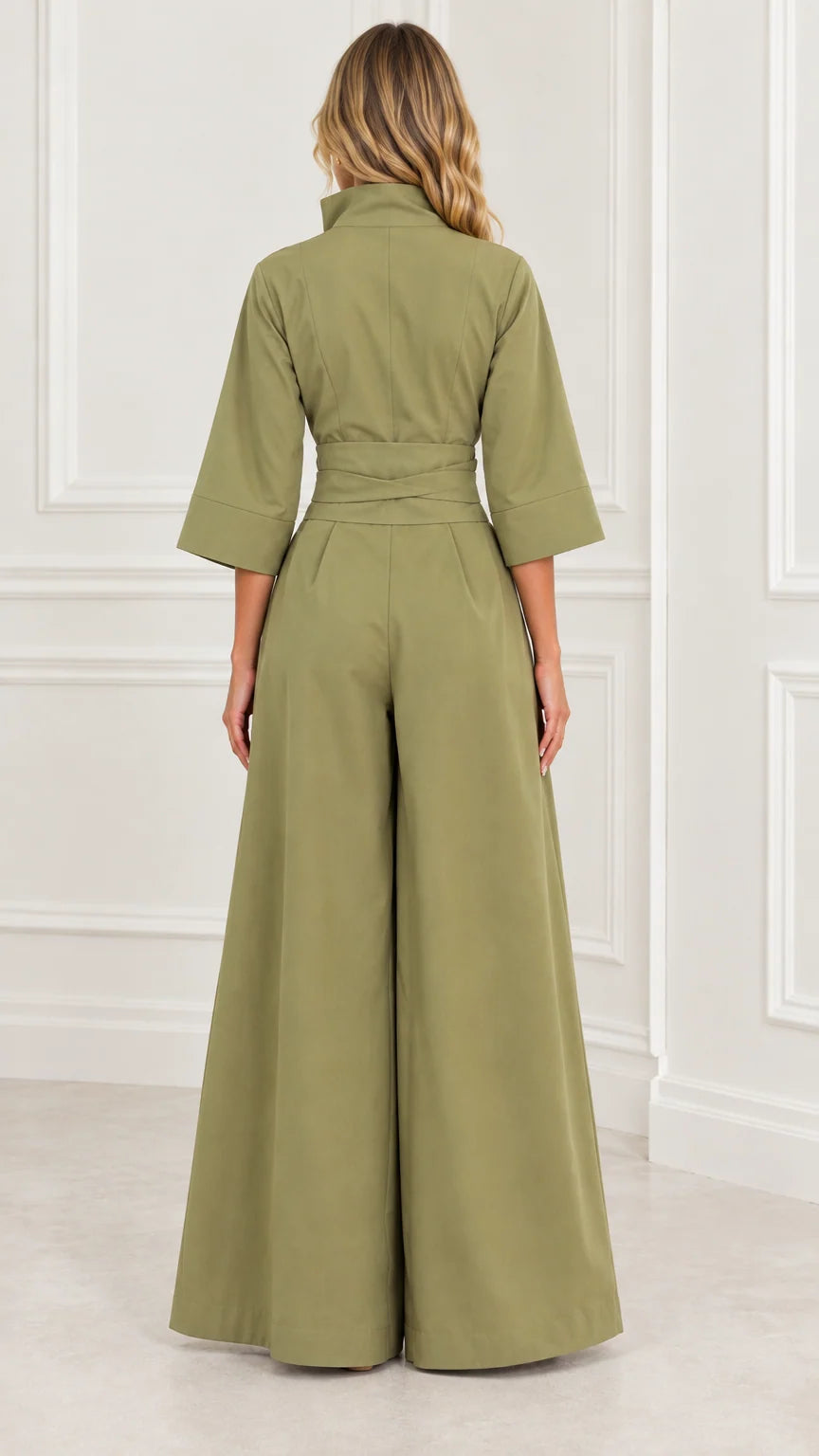 Back view of woman wearing an olive green wide-leg jumpsuit