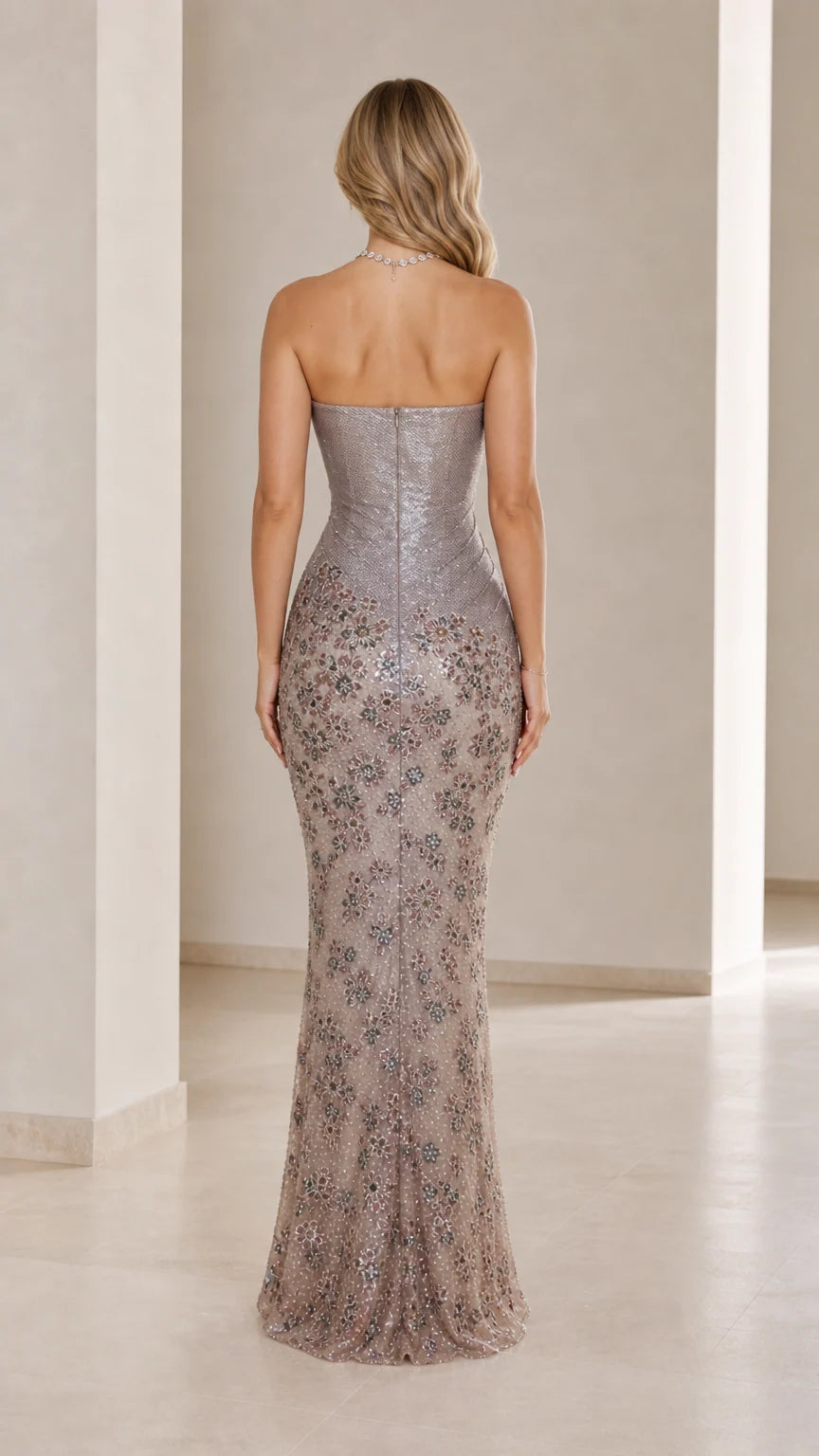 Back view of the silver floor-length strapless evening gown