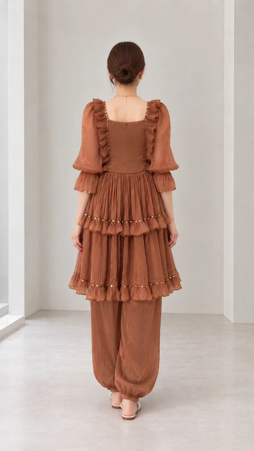 Back view of woman wearing Rust Brown square neck tiered ruffle matching outfit