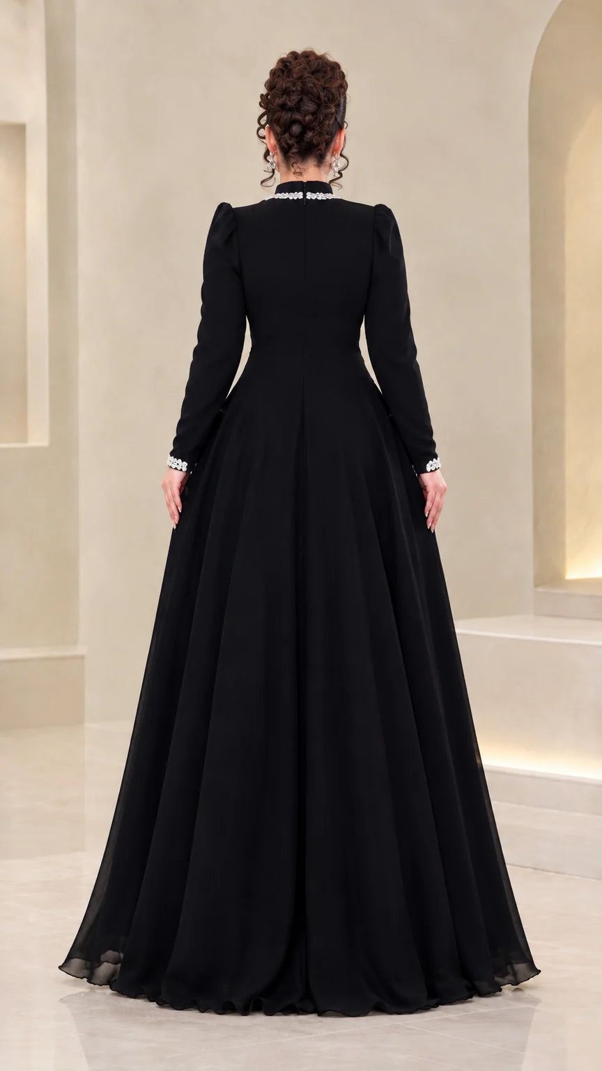 Back view of model wearing floor-length black chiffon evening dress