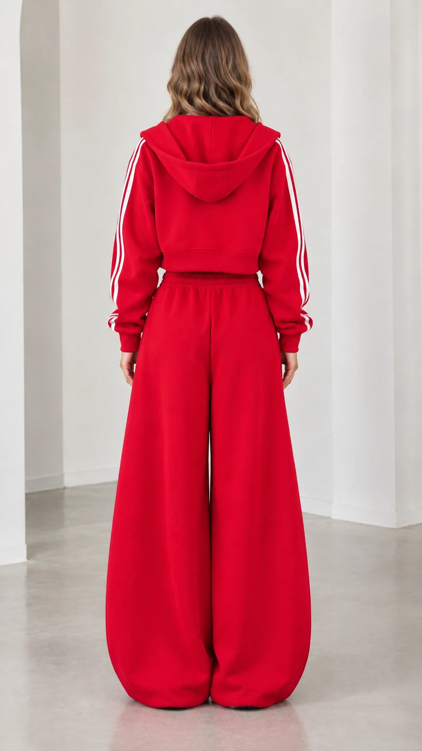 Model wearing red hooded tracksuit set back view