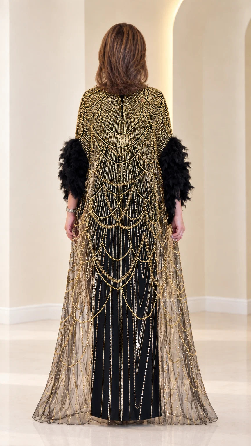 Back view of black beaded cape evening maxi dress