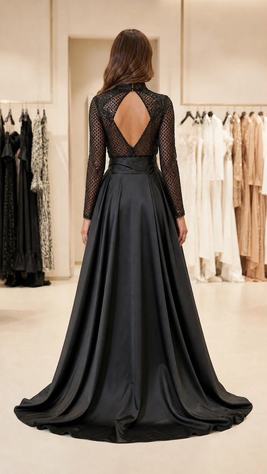 Back view of black jumpsuit highlighting keyhole cutout and overskirt train