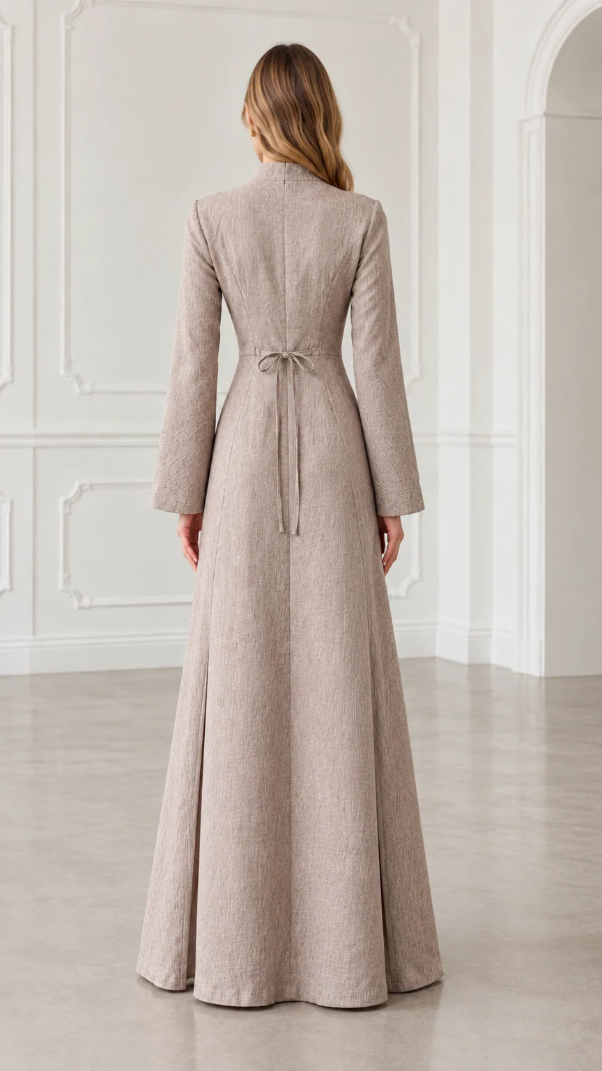 Back view of oatmeal maxi dress showing fitted waist and back tie detail