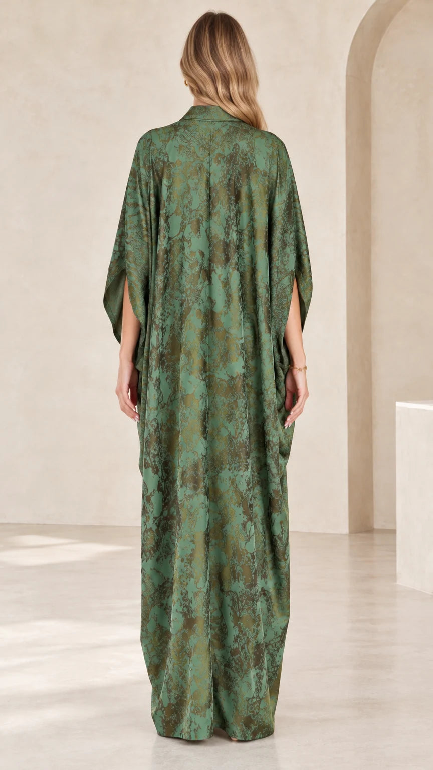 Back view of flowing green printed kaftan maxi dress