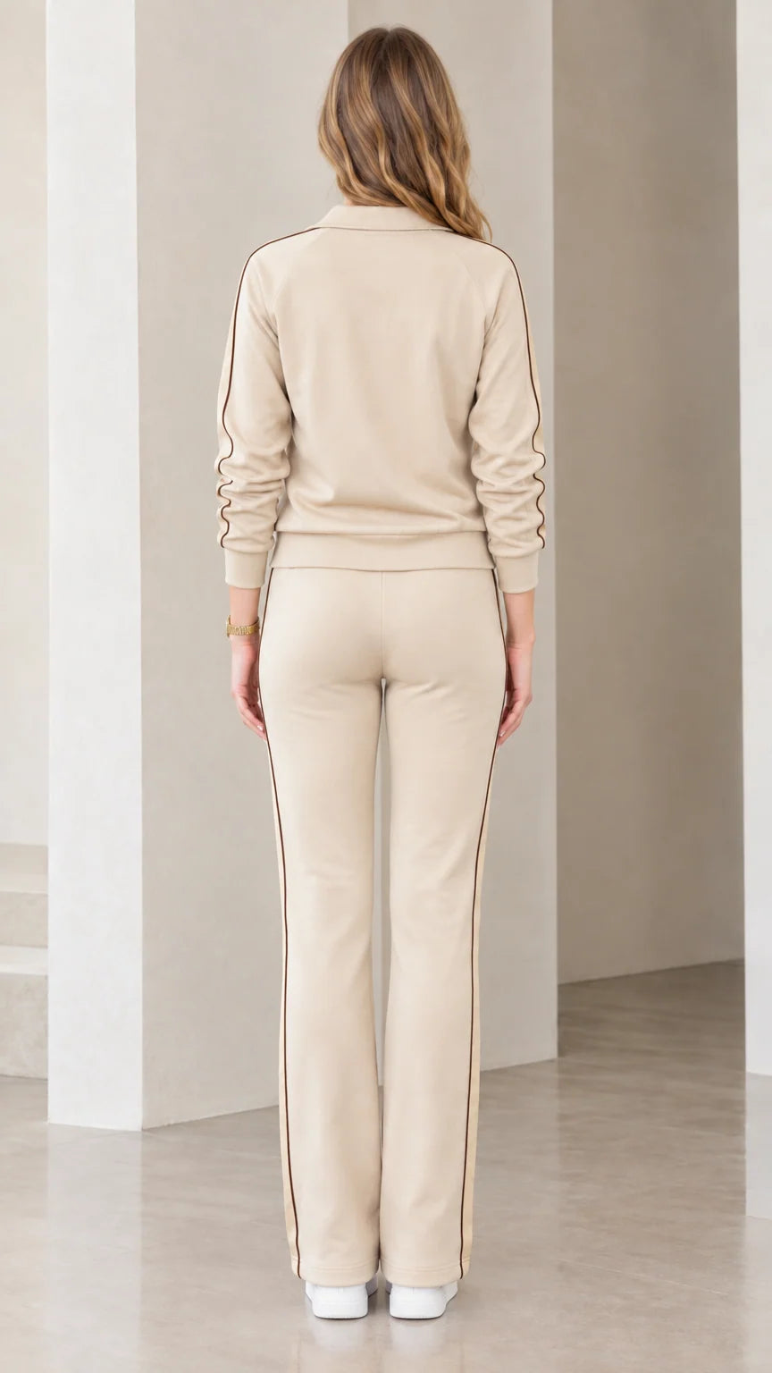 Back view of beige track jacket and straight-leg pants set