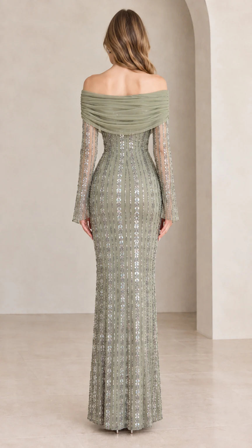 Back view of model showcasing draped back neckline and sequin detailing