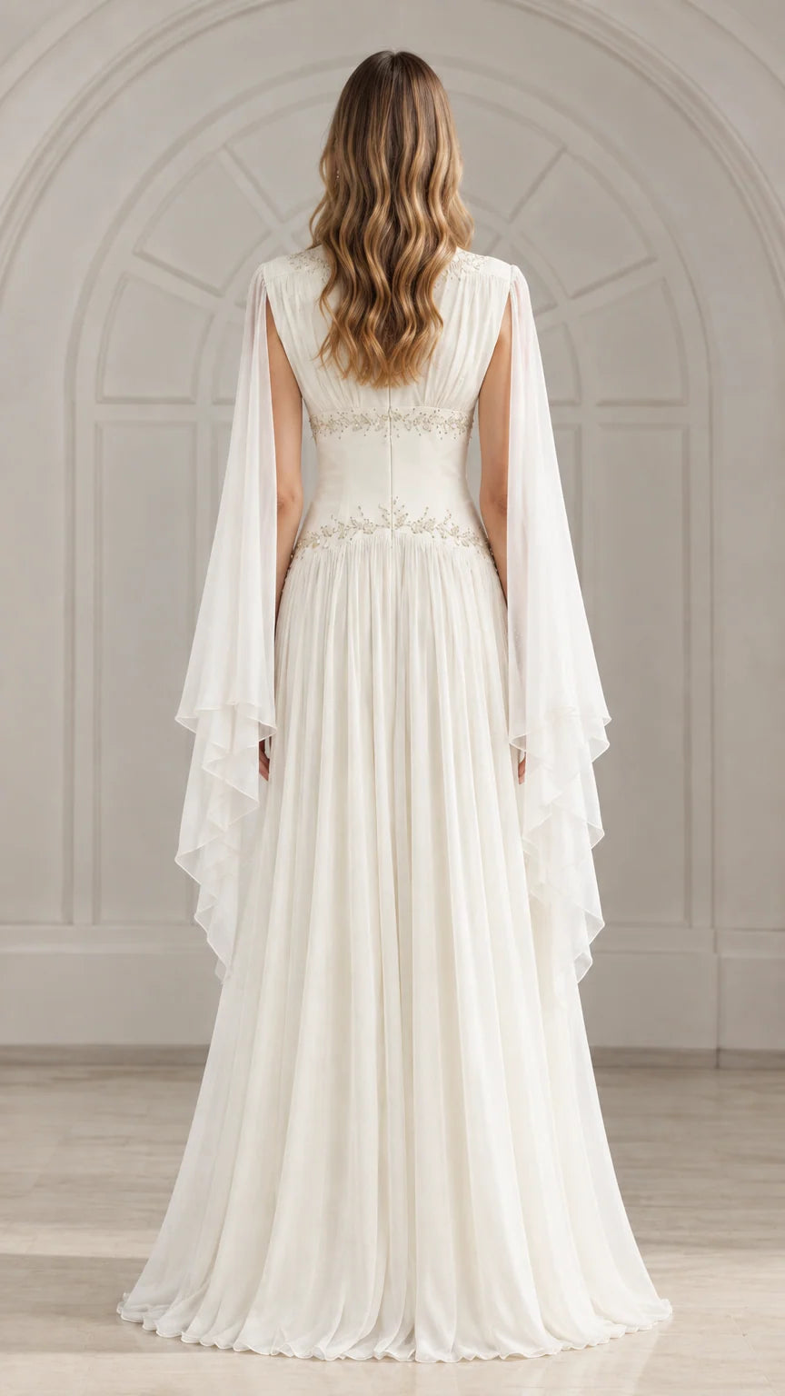 Back view of ivory white pleated chiffon gown showing back zipper and cape drape