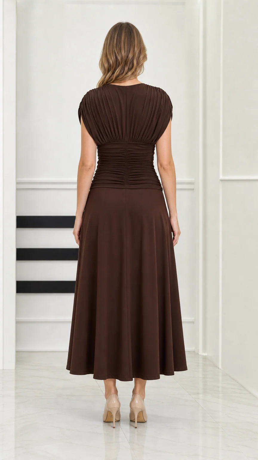 Back full-length view of model wearing chocolate brown ruched back midi dress
