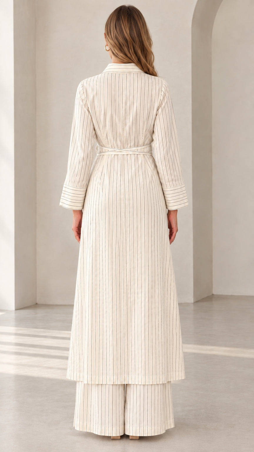 Back view of woman wearing Cream pinstripe maxi tunic and wide-leg pants