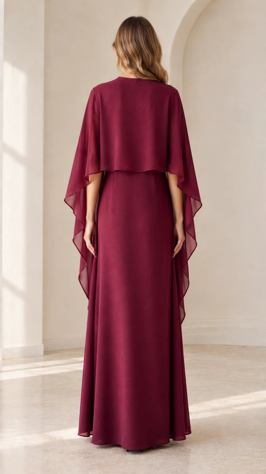 Back view of burgundy capelet maxi dress showing draped cape