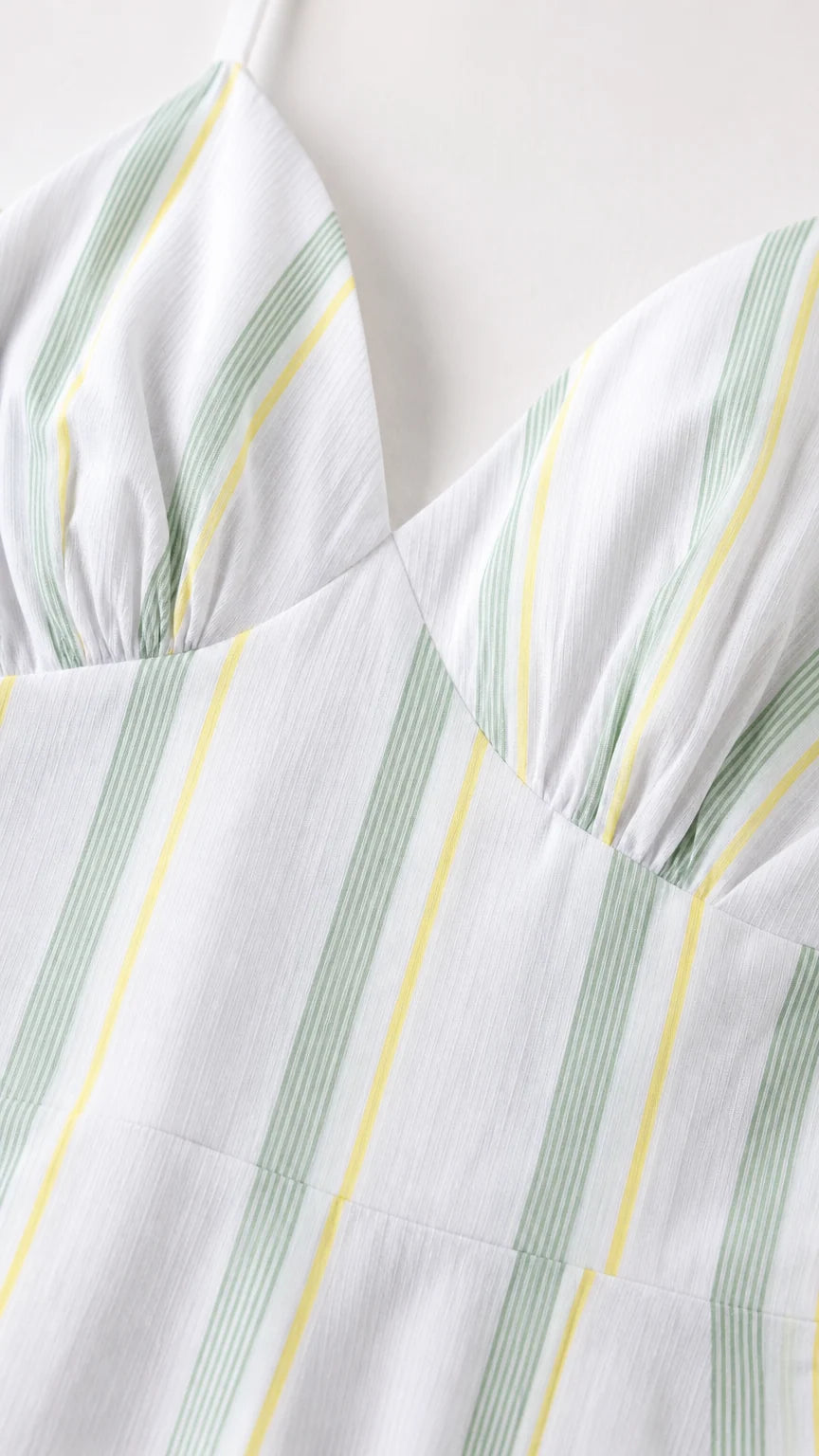 Close-up detail of the gathered bodice and vertical stripe pattern