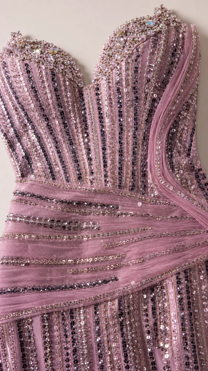 Close-up detail of embellished sweetheart bodice with sequins and draped tulle