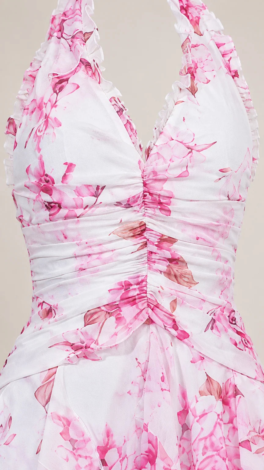 Close-up detail of ruched halter bodice with delicate floral pattern