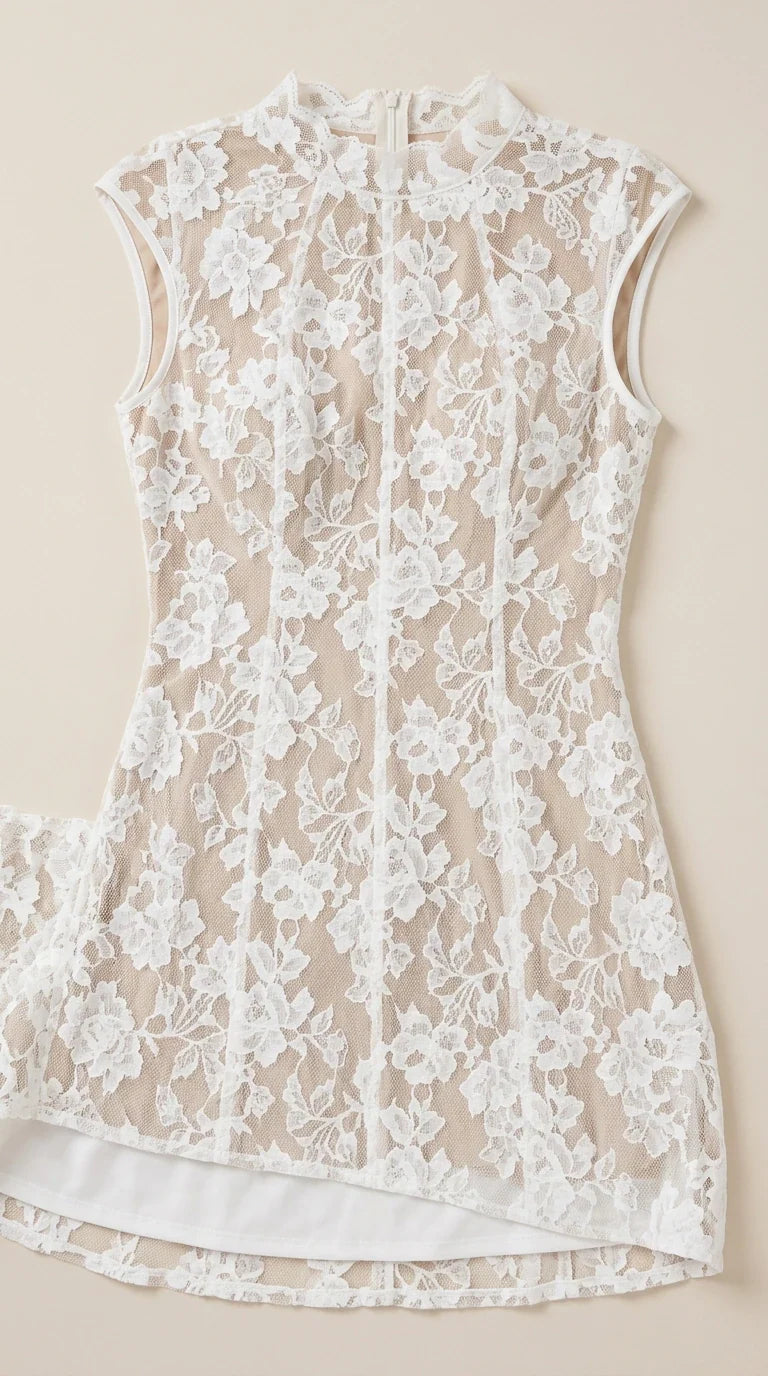 Close up flat lay detail of white floral lace bodice and lining