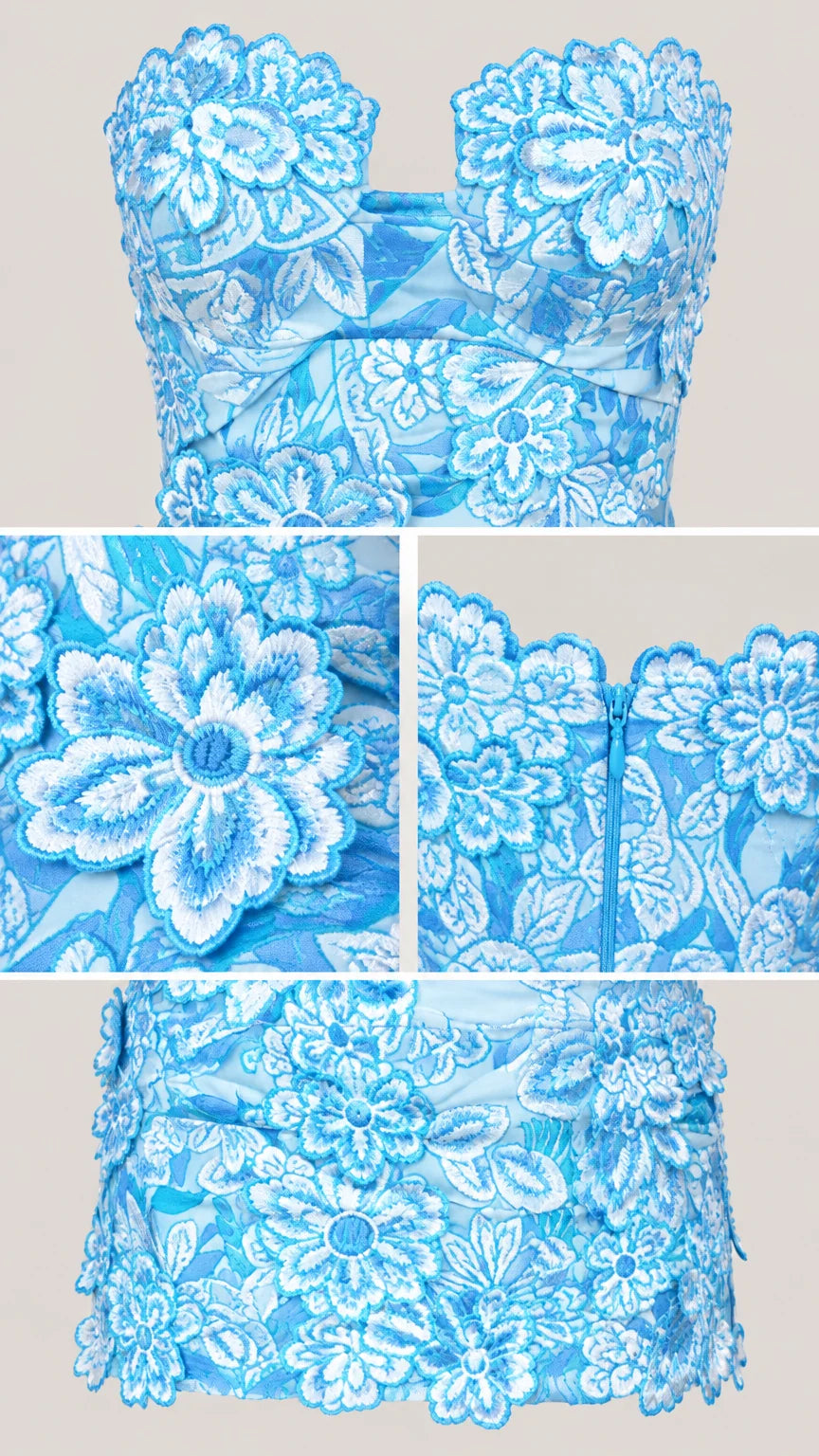 Close-up details of floral lace embroidery, scalloped neckline, and zip closure