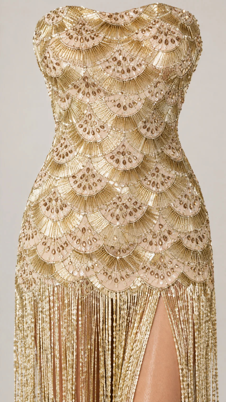 Close-up detail of Champagne Gold scallop sequin embroidery and hanging fringe tassels