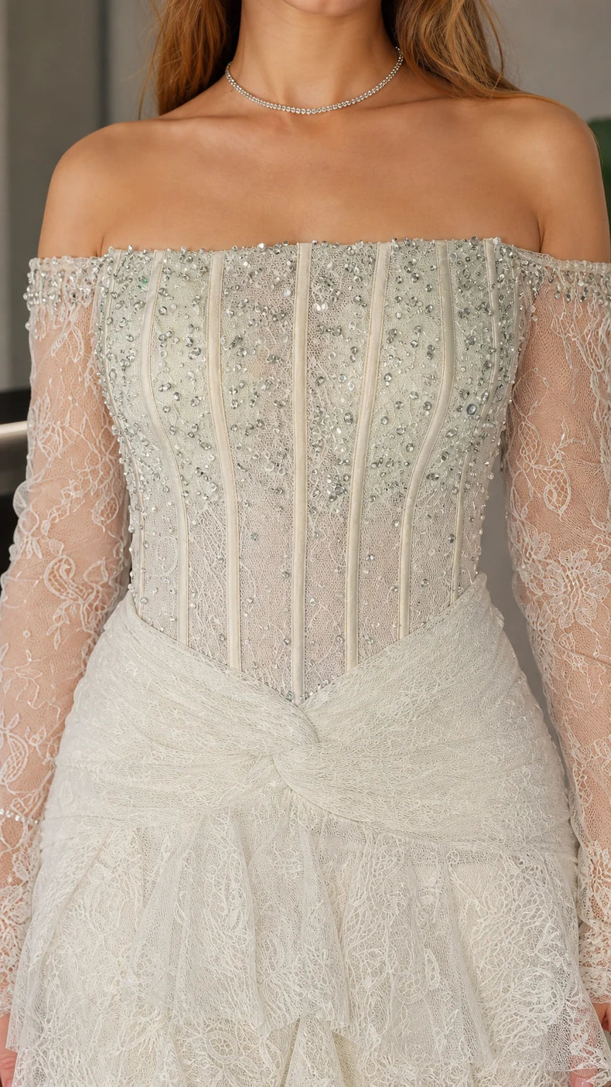 Close-up detail of beaded corset bodice and off-shoulder neckline
