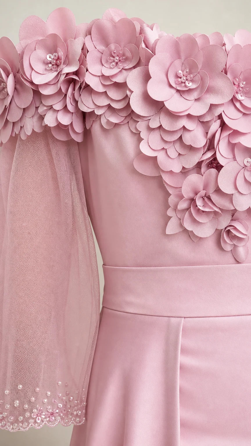Close-up of 3D floral appliques and sheer sleeve