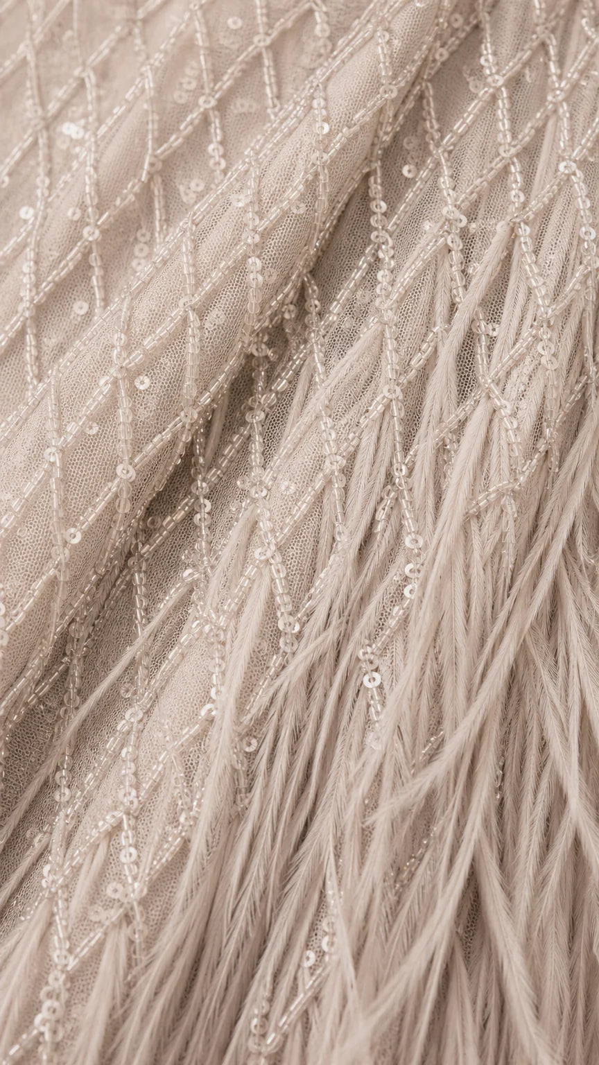 Close-up detail of sequin embroidery and feather texture