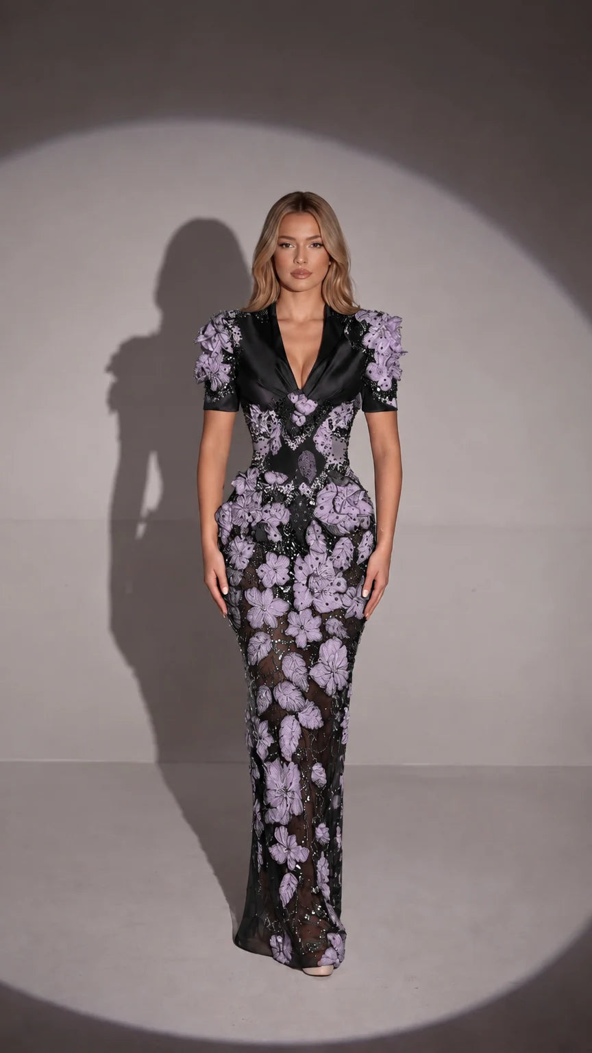 Front view of black 3D floral appliqué embellished formal gown