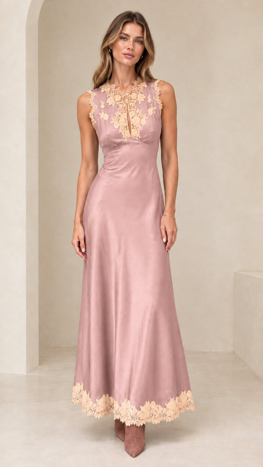 Model wearing dusty rose pink satin maxi dress with lace bodice