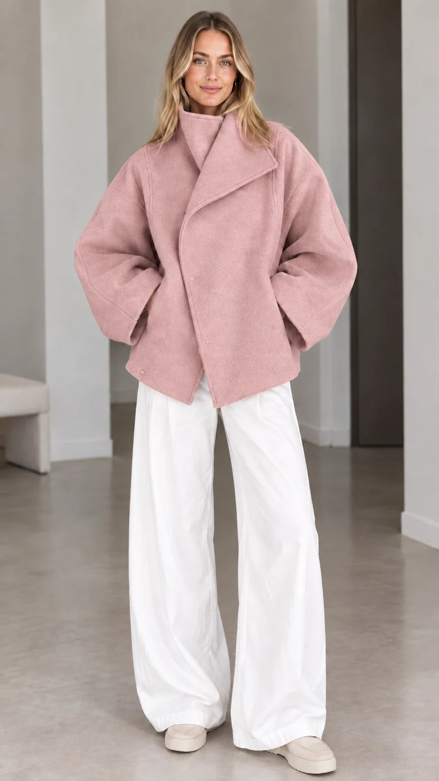 Model wearing dusty pink fold-over collar relaxed short coat