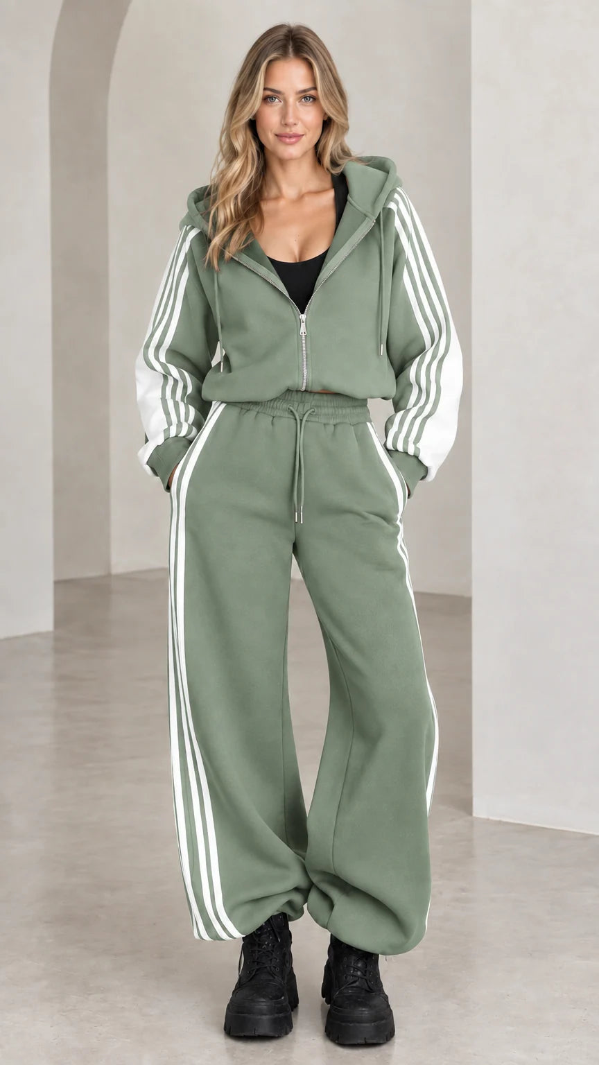 Front view of model wearing sage green two-piece striped tracksuit set