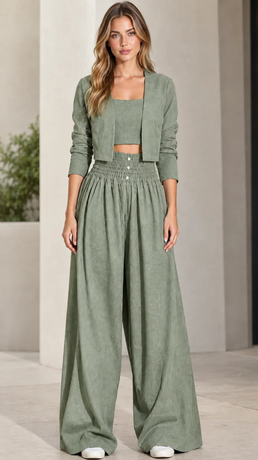 Front view of model wearing sage green 3-piece crop top, jacket, and wide-leg pants set