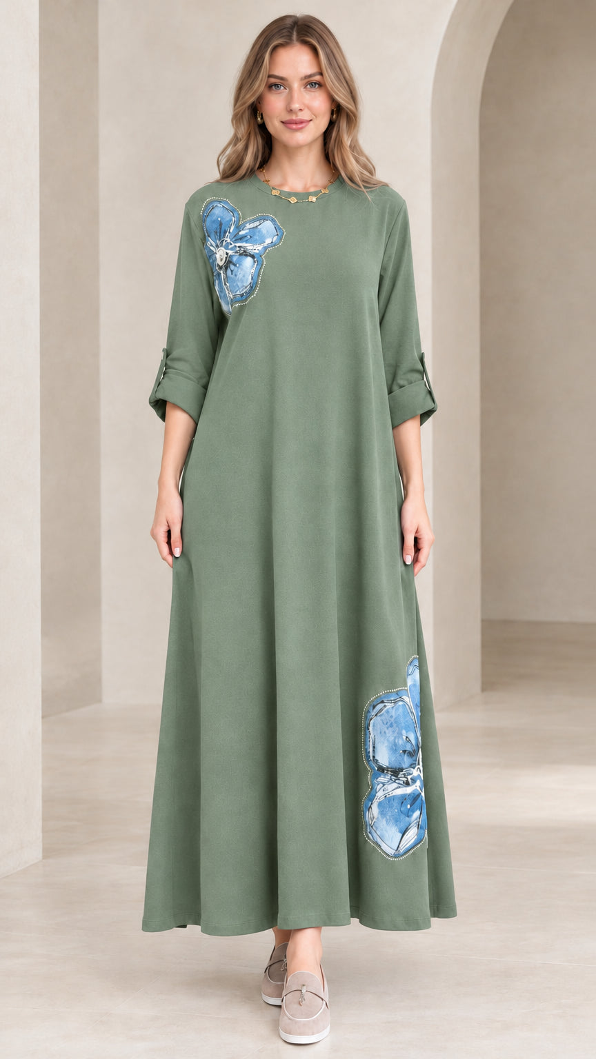 Model wearing sage green floral appliqué maxi dress